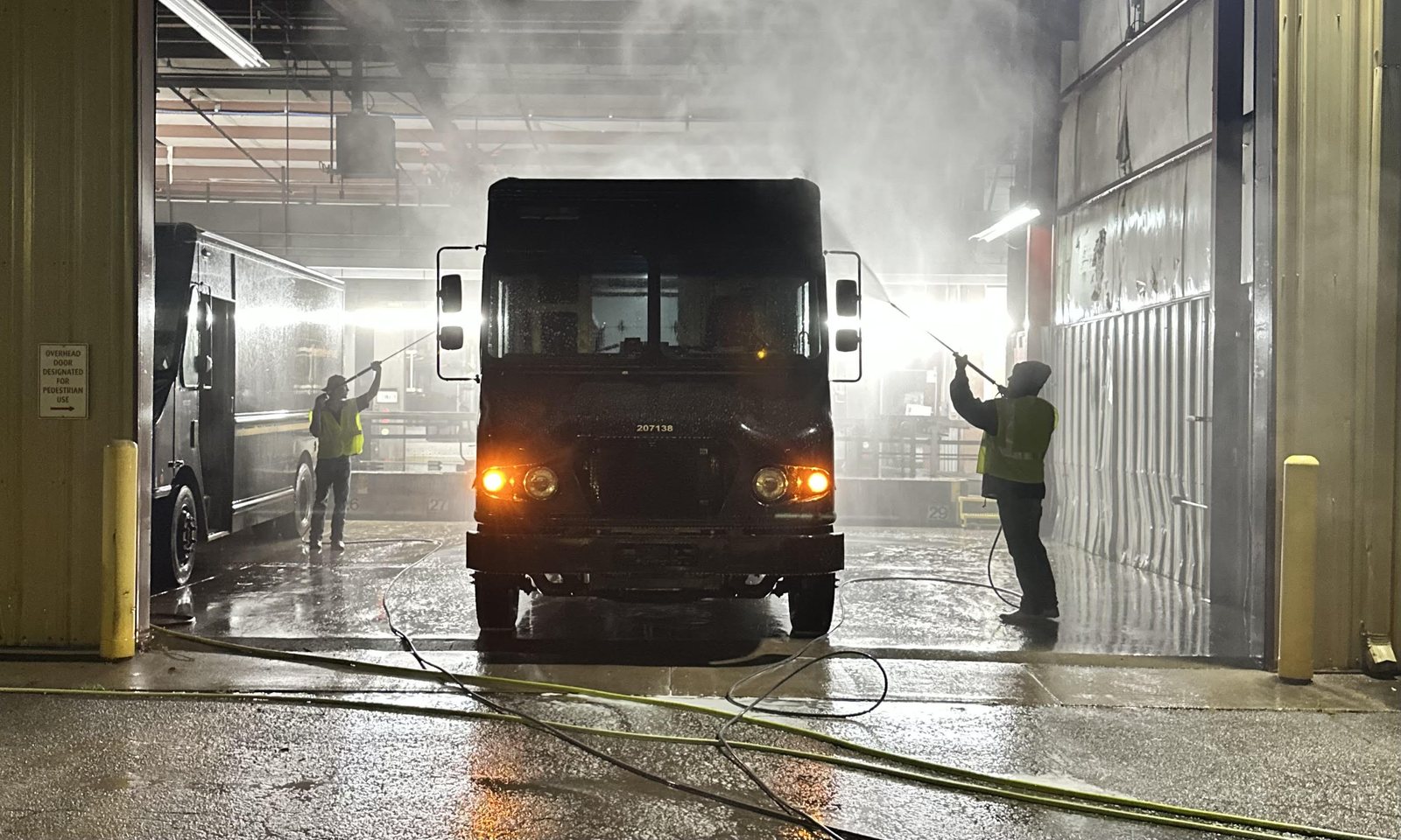 Prestige Pro Wash crew washing a package delivery fleet overnight